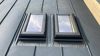 Завершённый монтаж мансардных окон со снегозадержателями